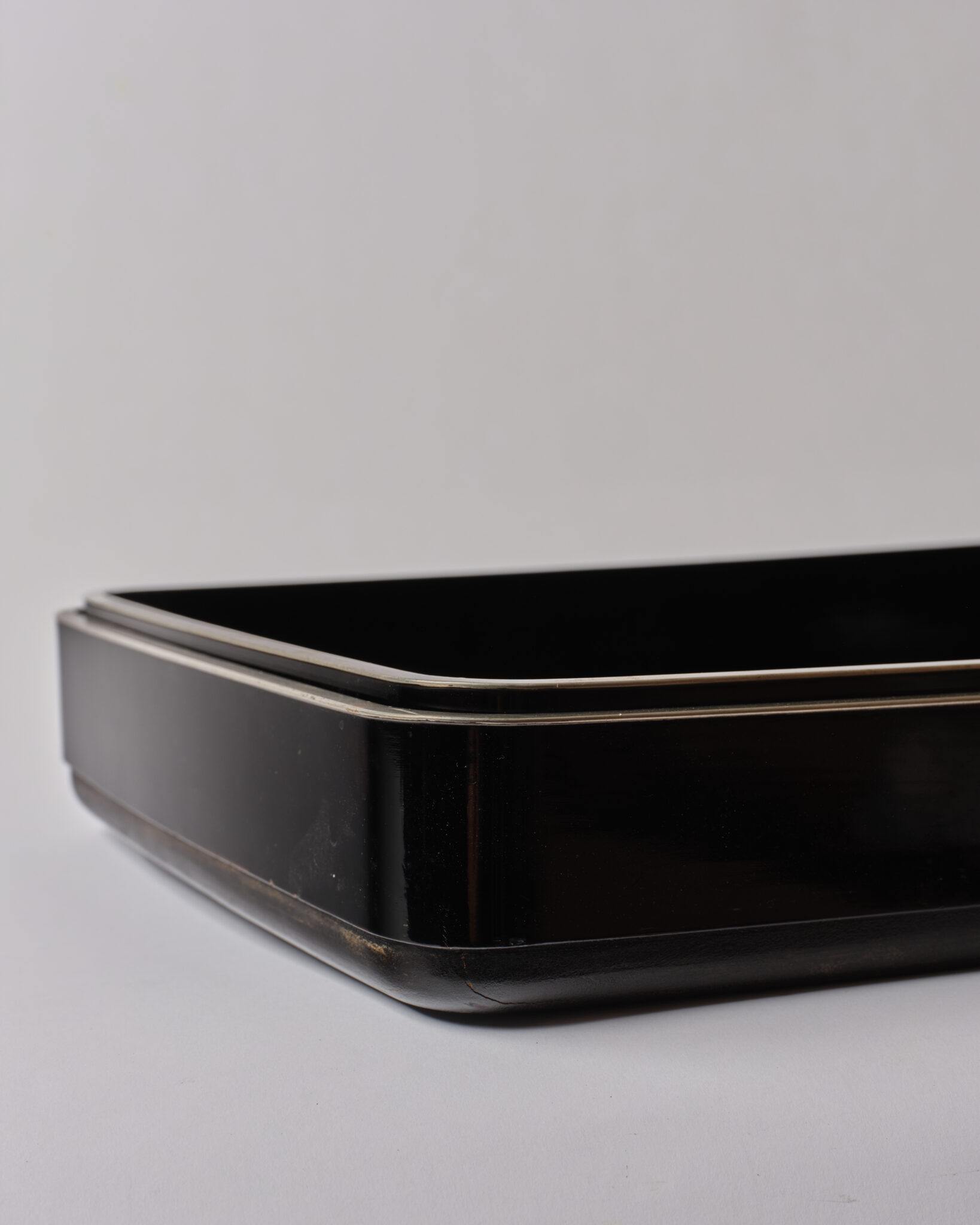 Pair of Japanese Lacquer Nesting Trays with Silver Rims
