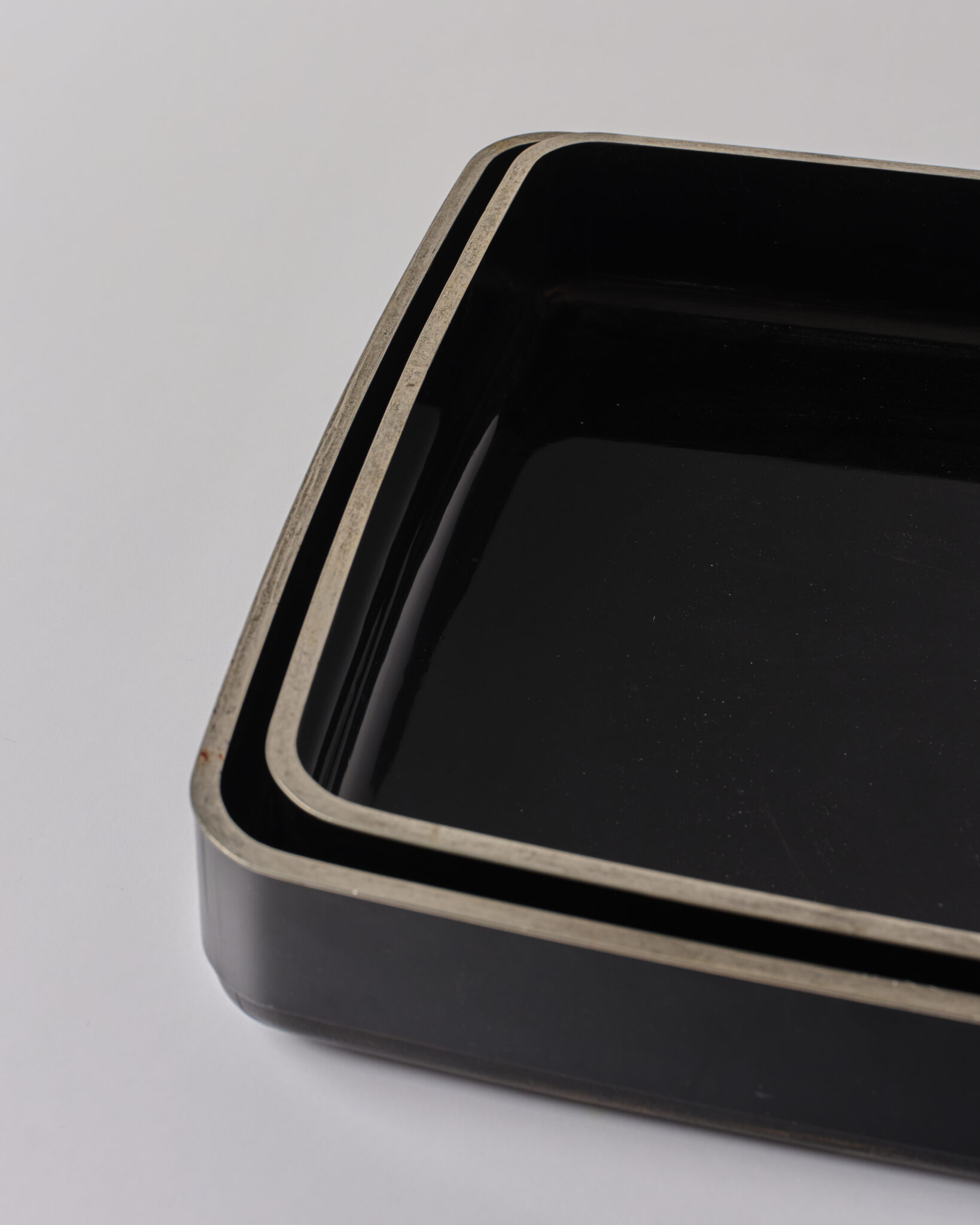 Pair of Japanese Lacquer Nesting Trays with Silver Rims