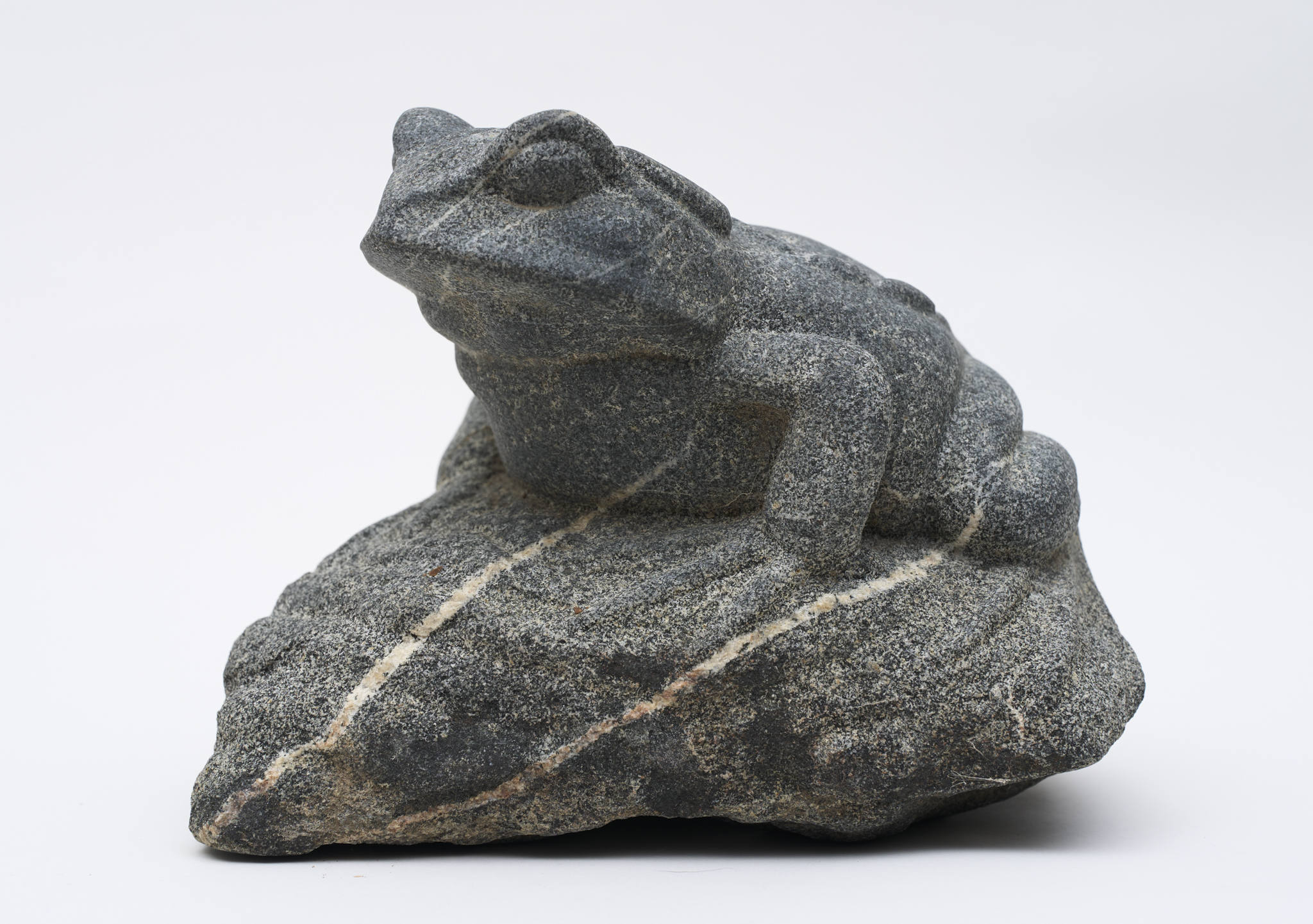 Hand-Carved Toad on a Rock